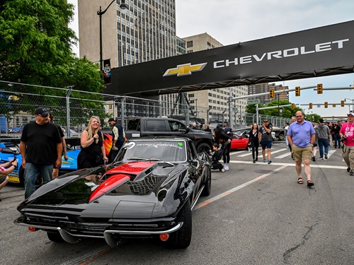 A fan inspects a car at Cruise Night