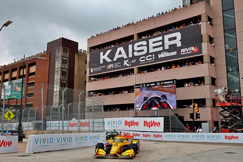 Fans enjoy cars on track from the viewing of the Port Atwater Garage